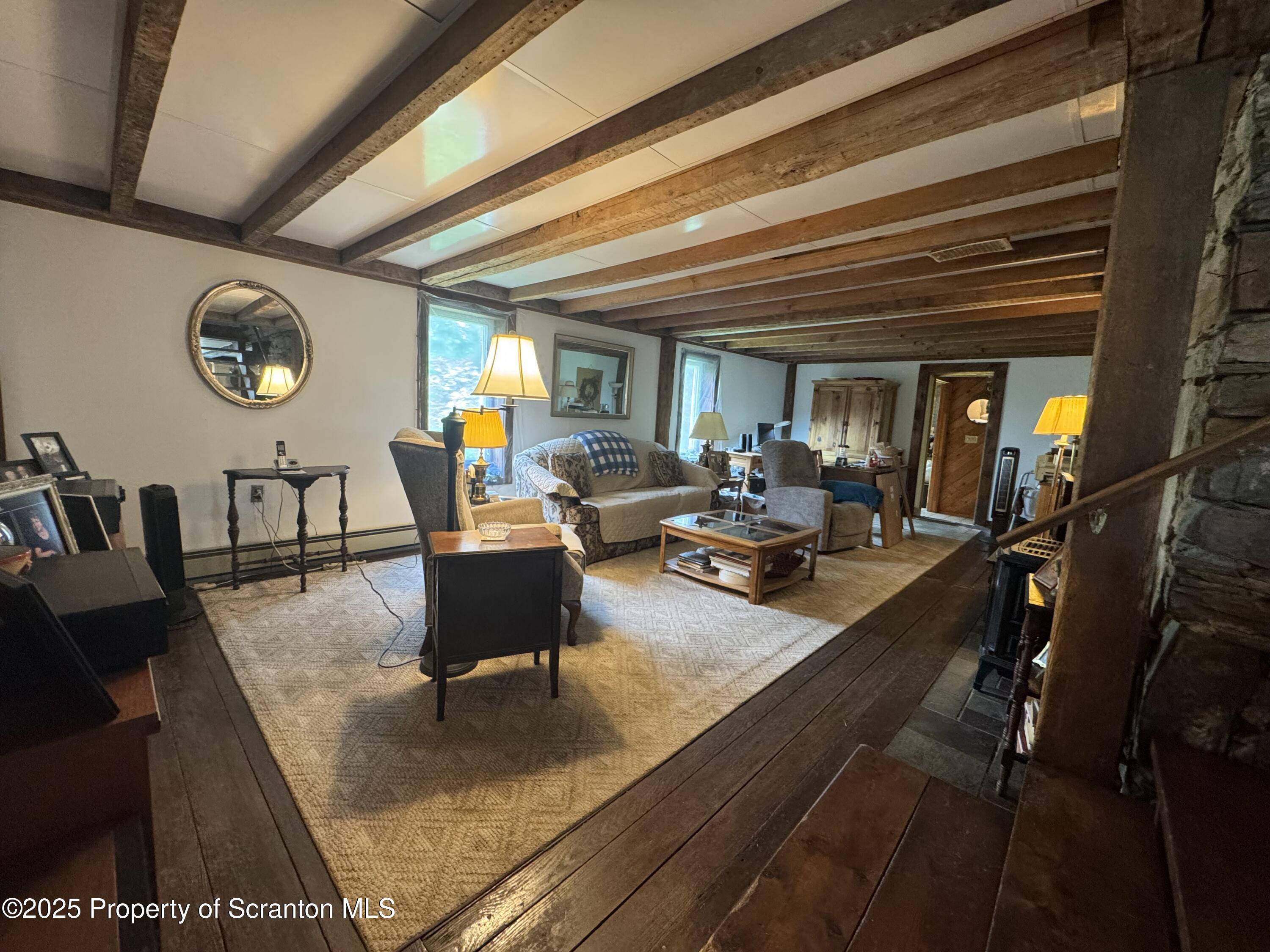1325 Fairview Road Clarks Summit, PA 18411 - Photo 7 of 21 a living room with furniture and a large window