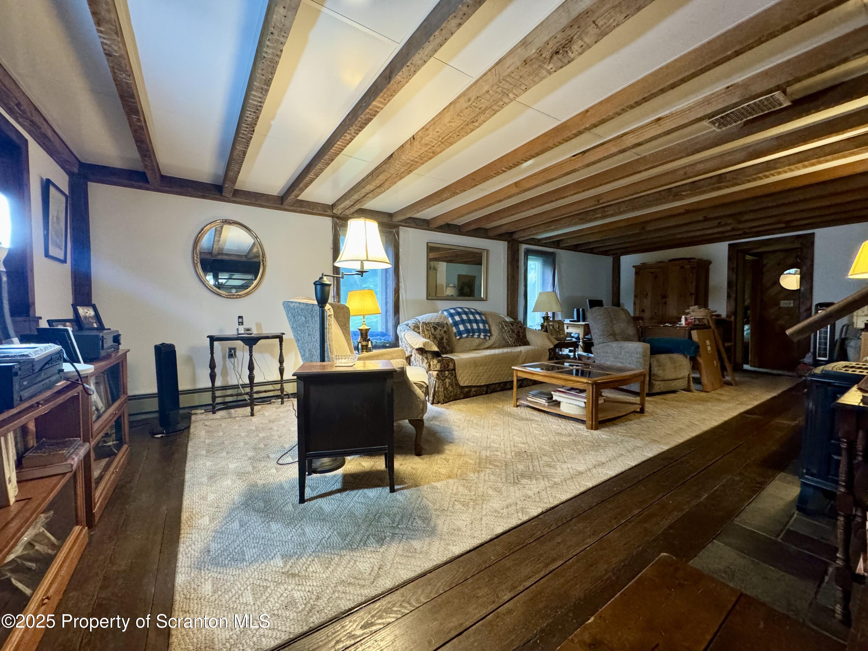 1325 Fairview Road Clarks Summit, PA 18411 - Photo 8 of 21 a living room with furniture and a wooden floor