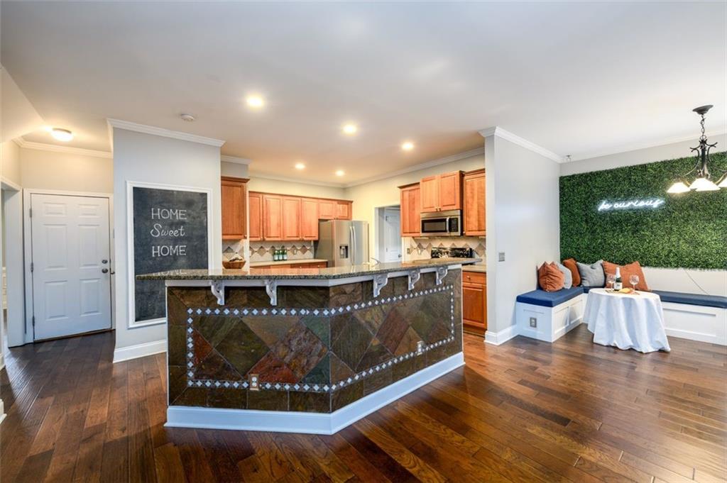 284 Graymist Path Southwest Loganville, GA 30052 - Photo 14 of 45 a living room with furniture and a wooden floor