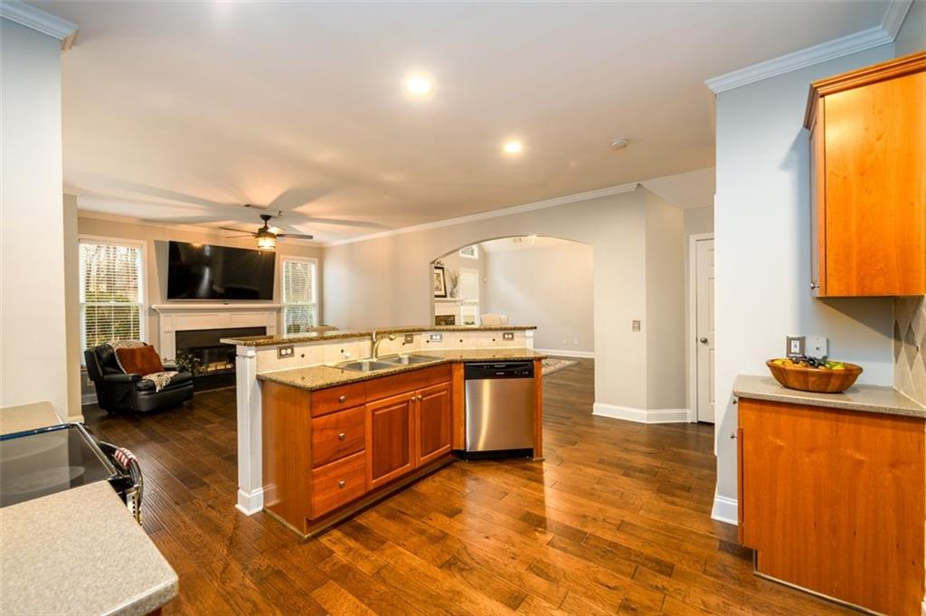 284 Graymist Path Southwest Loganville, GA 30052 - Photo 18 of 45 a large kitchen with stainless steel appliances granite countertop a stove and a sink