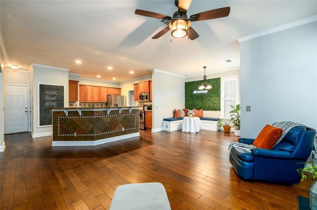 284 Graymist Path Southwest Loganville, GA 30052 - Photo 21 of 45 a living room with furniture and a chandelier