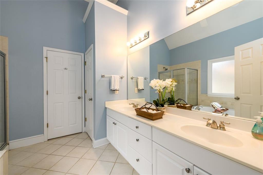 284 Graymist Path Southwest Loganville, GA 30052 - Photo 25 of 45 a bathroom with a sink and a mirror