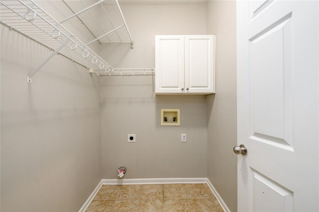 284 Graymist Path Southwest Loganville, GA 30052 - Photo 27 of 45 a view of storage and utility room with empty racks