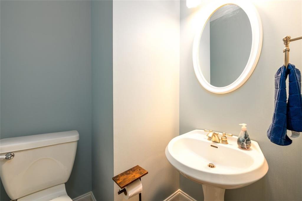 284 Graymist Path Southwest Loganville, GA 30052 - Photo 28 of 45 a bathroom with a toilet sink and mirror