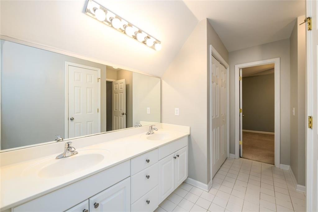 284 Graymist Path Southwest Loganville, GA 30052 - Photo 37 of 45 a bathroom with a double vanity sink mirror and double