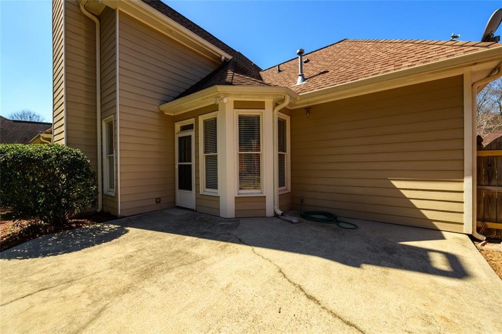 284 Graymist Path Southwest Loganville, GA 30052 - Photo 39 of 45 a view of house with backyard and trees in the background