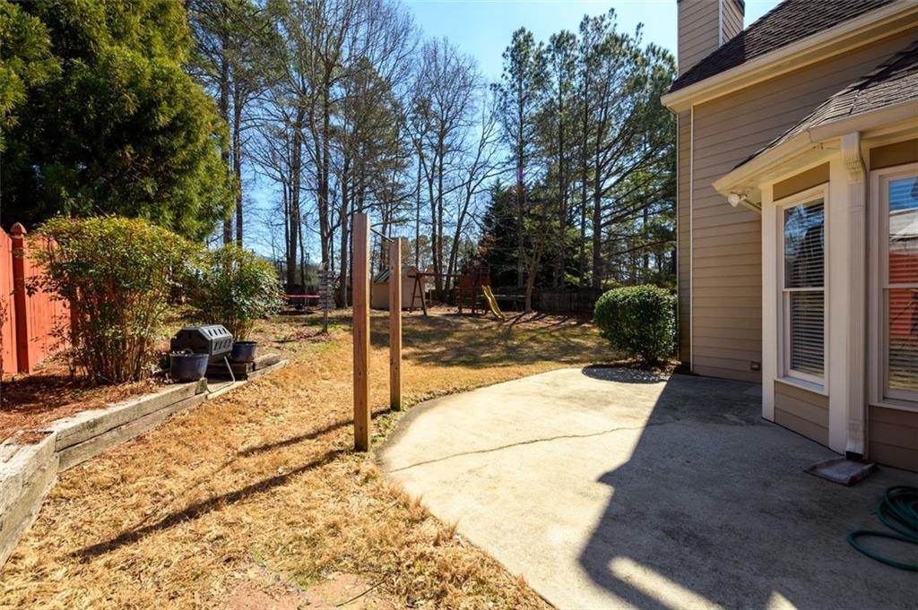 284 Graymist Path Southwest Loganville, GA 30052 - Photo 40 of 45 a view of a backyard with sitting area