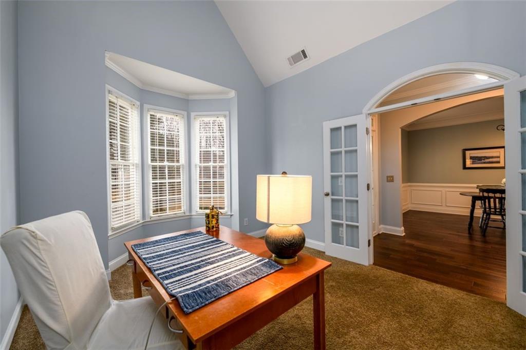 284 Graymist Path Southwest Loganville, GA 30052 - Photo 5 of 45 a bedroom with furniture and a window