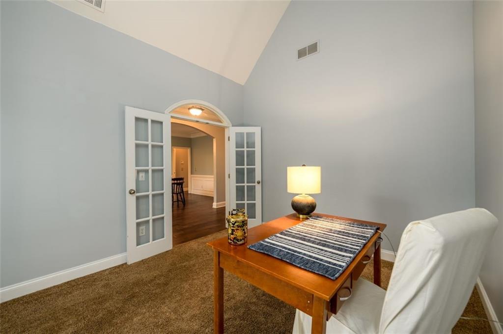 284 Graymist Path Southwest Loganville, GA 30052 - Photo 6 of 45 a bedroom with a bed and a window