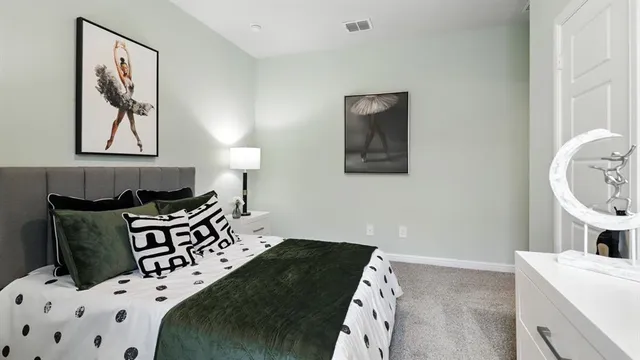 a bedroom with a bed and a mirror