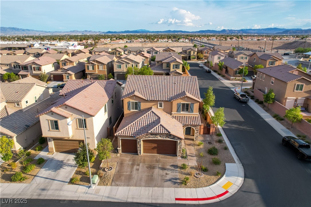 7311 Spring Flower Avenue Las Vegas, NV 89117 - Photo 8 of 48 Aerial perspective of suburban area with a mountain backdrop