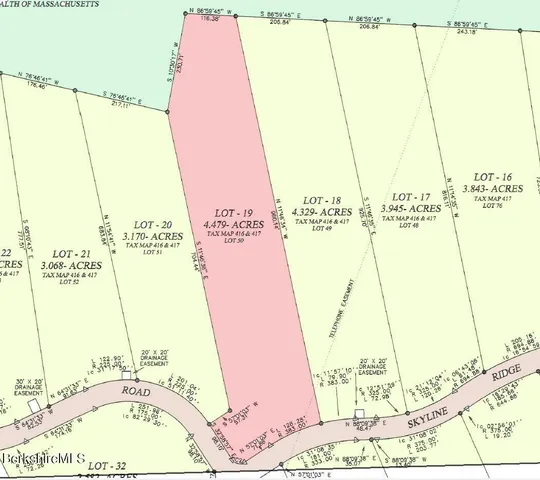 a close up of a wall with a large mirror