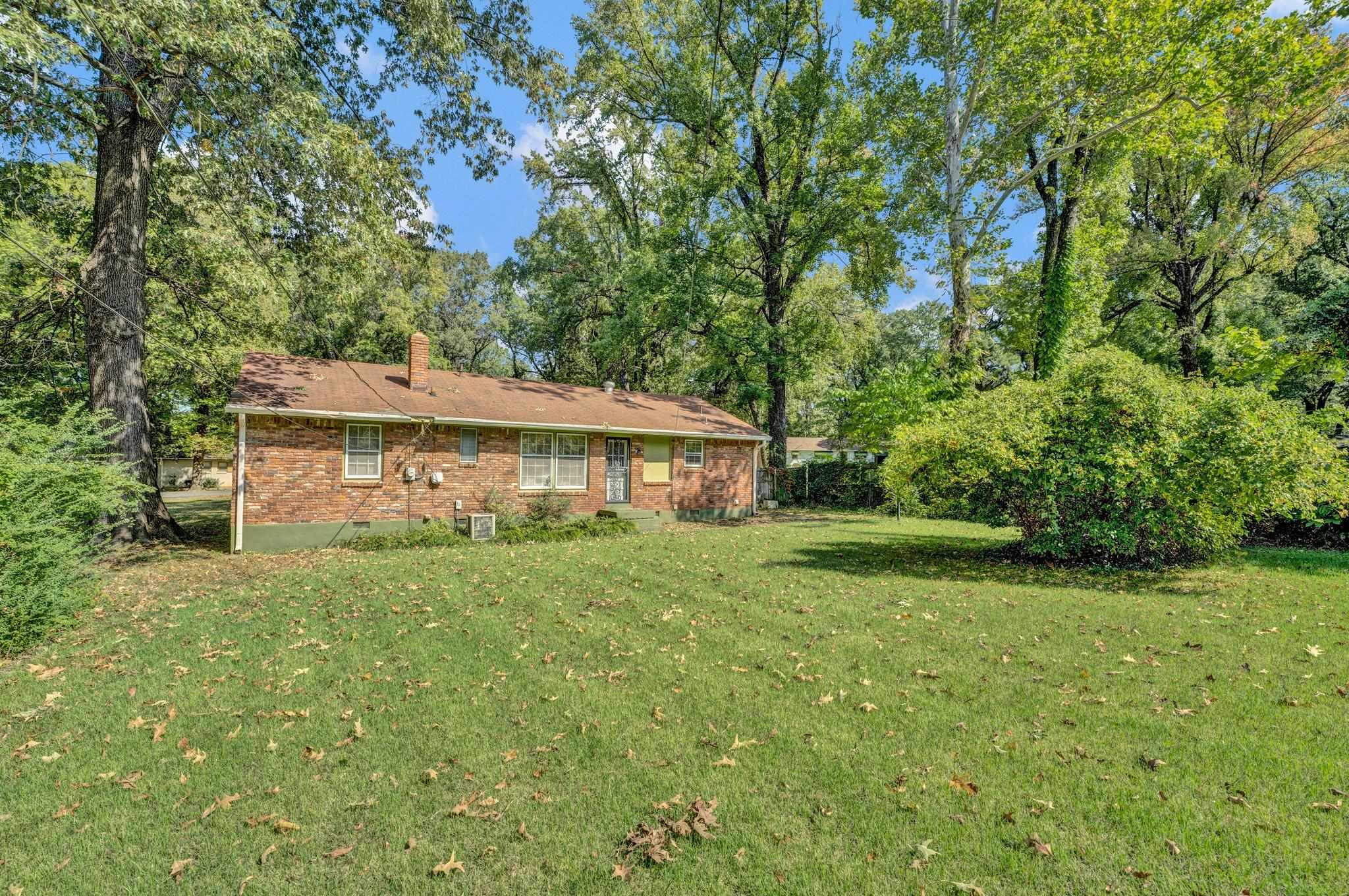 4909 Lochinvar Road Memphis, TN 38116 - Photo 18 of 21 View of yard featuring central AC unit