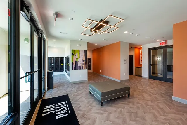 a view of lobby with furniture and a rug