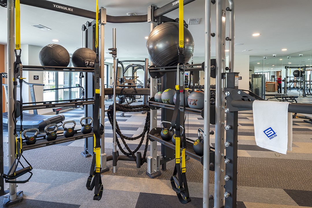 1724 Partnership Way, Unit 1263 Katy, TX 77449 - Photo 21 of 26 a gym room with lots of gym equipment