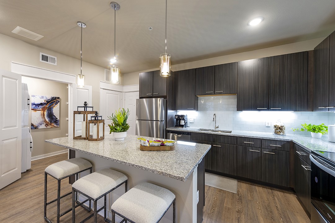 1724 Partnership Way, Unit 1263 Katy, TX 77449 - Photo 6 of 26 a kitchen with sink cabinets and wooden floor