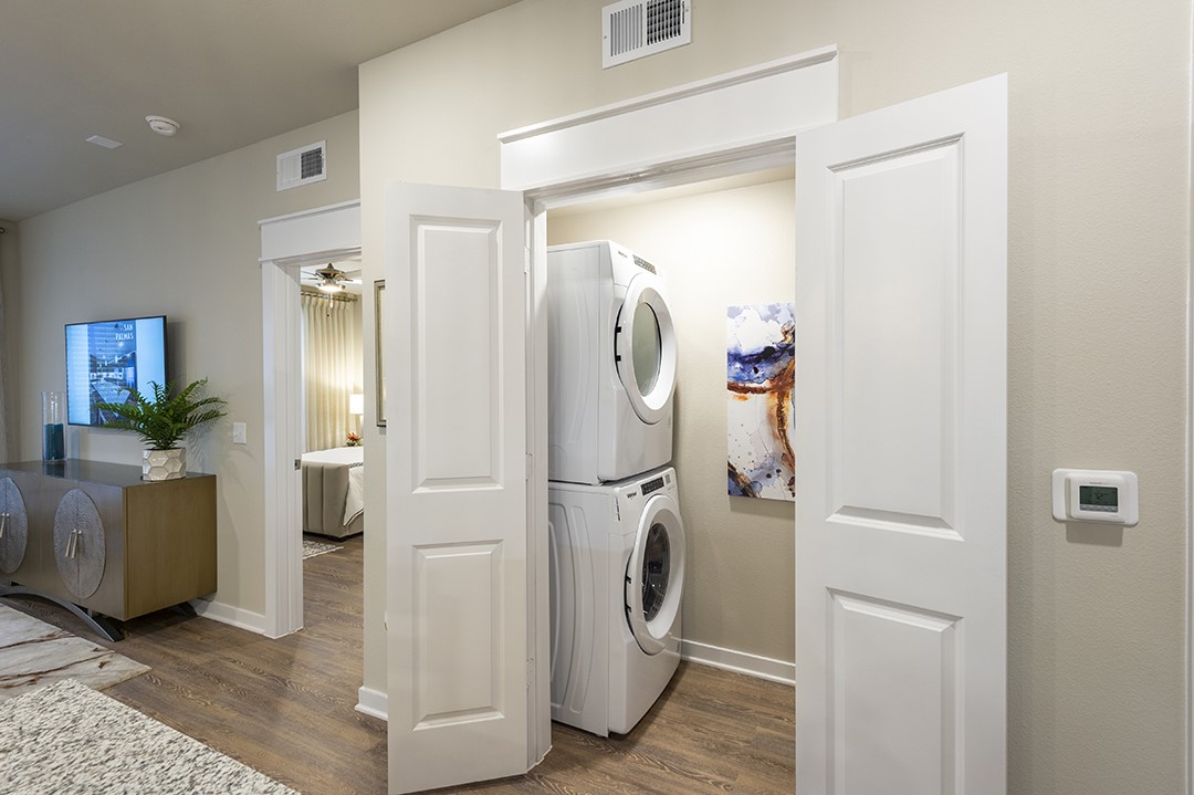 1724 Partnership Way, Unit 1263 Katy, TX 77449 - Photo 7 of 26 a view of a storage & utility room with a washer and dryer