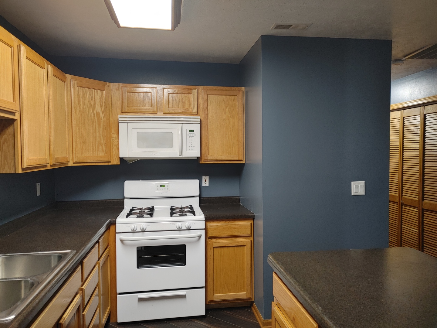 150 North Wooster Street, Unit 9 Capron, IL 61012 - Photo 13 of 23 a kitchen with a stove and a sink