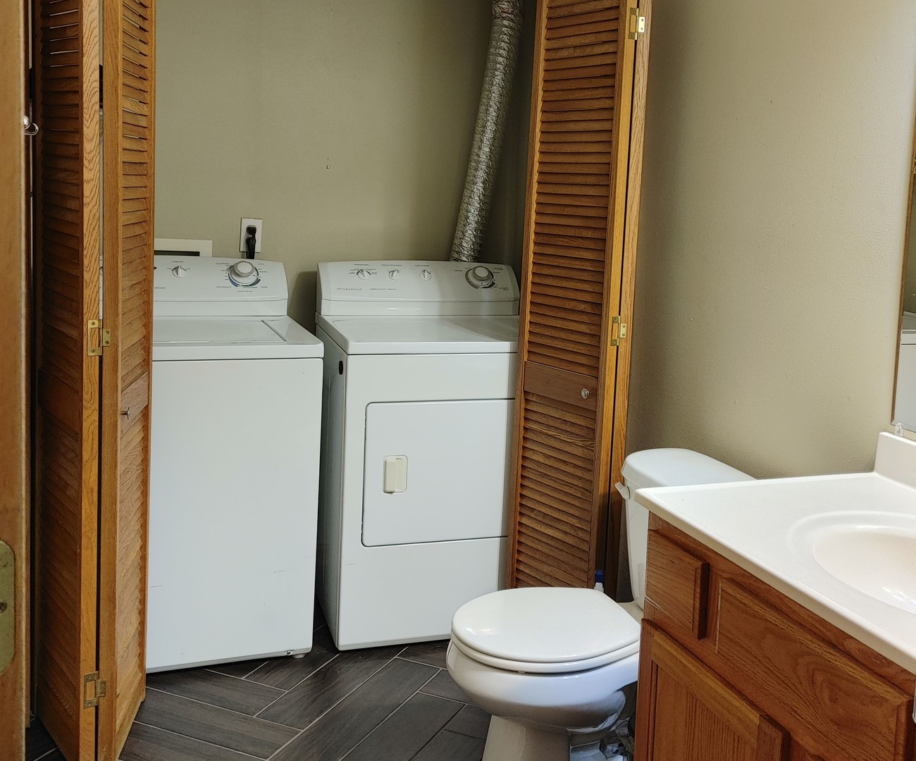 150 North Wooster Street, Unit 9 Capron, IL 61012 - Photo 17 of 23 a bathroom with a sink toilet and mirror
