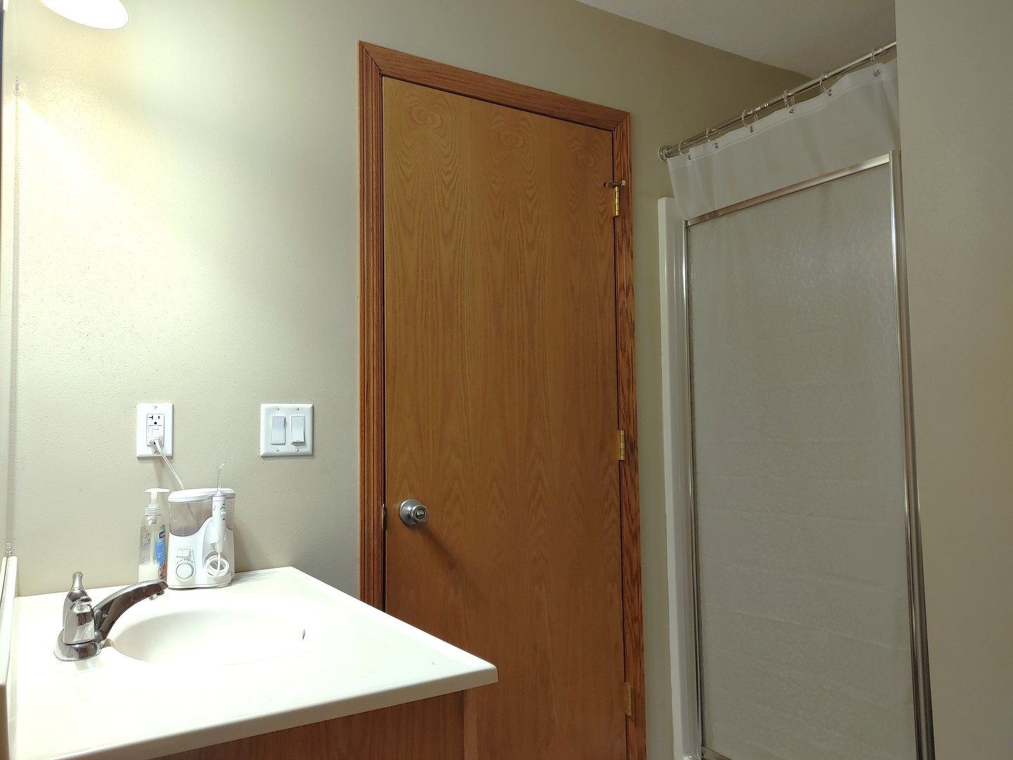 150 North Wooster Street, Unit 9 Capron, IL 61012 - Photo 19 of 23 a bathroom with a sink and a mirror