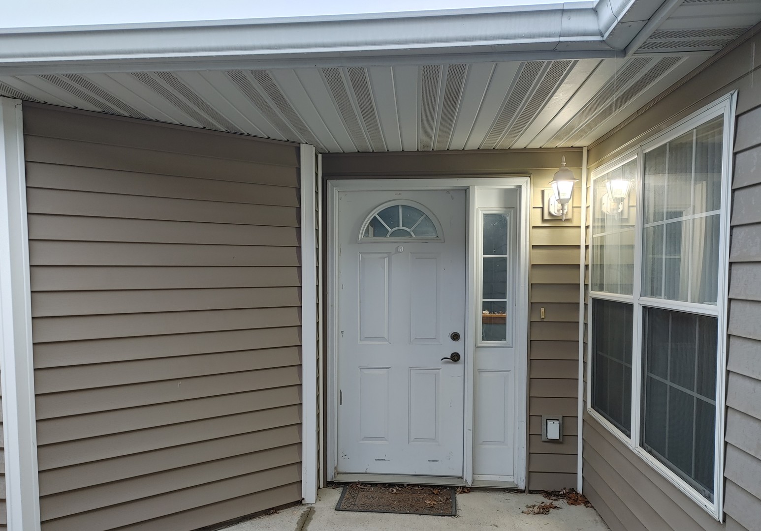 150 North Wooster Street, Unit 9 Capron, IL 61012 - Photo 2 of 23 a view of front door