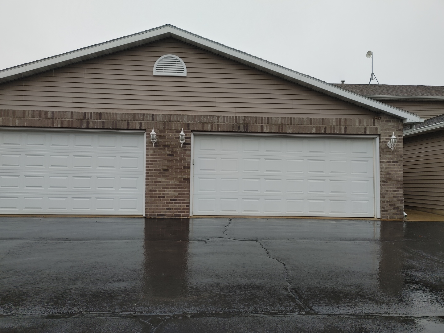 150 North Wooster Street, Unit 9 Capron, IL 61012 - Photo 22 of 23 a front view of a house with garage