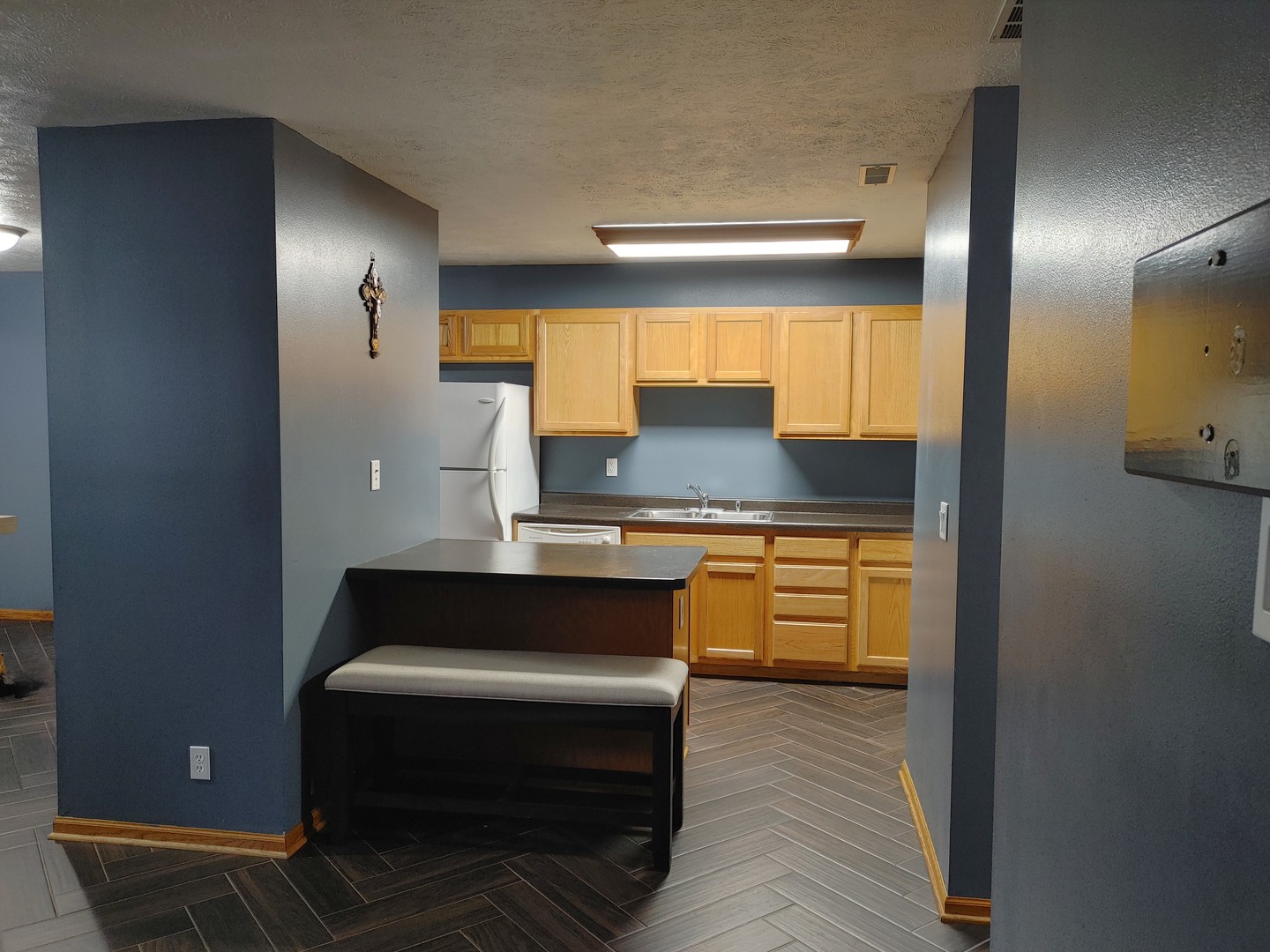150 North Wooster Street, Unit 9 Capron, IL 61012 - Photo 8 of 23 a kitchen with granite countertop a sink and a stove