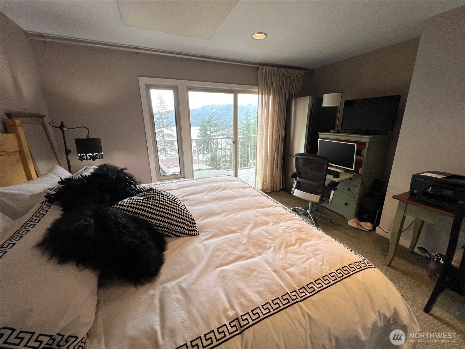 1917 Rosario Road, Unit 2115 Orcas Island, WA 98245 - Photo 11 of 14 a bedroom with a bed a television and a large window