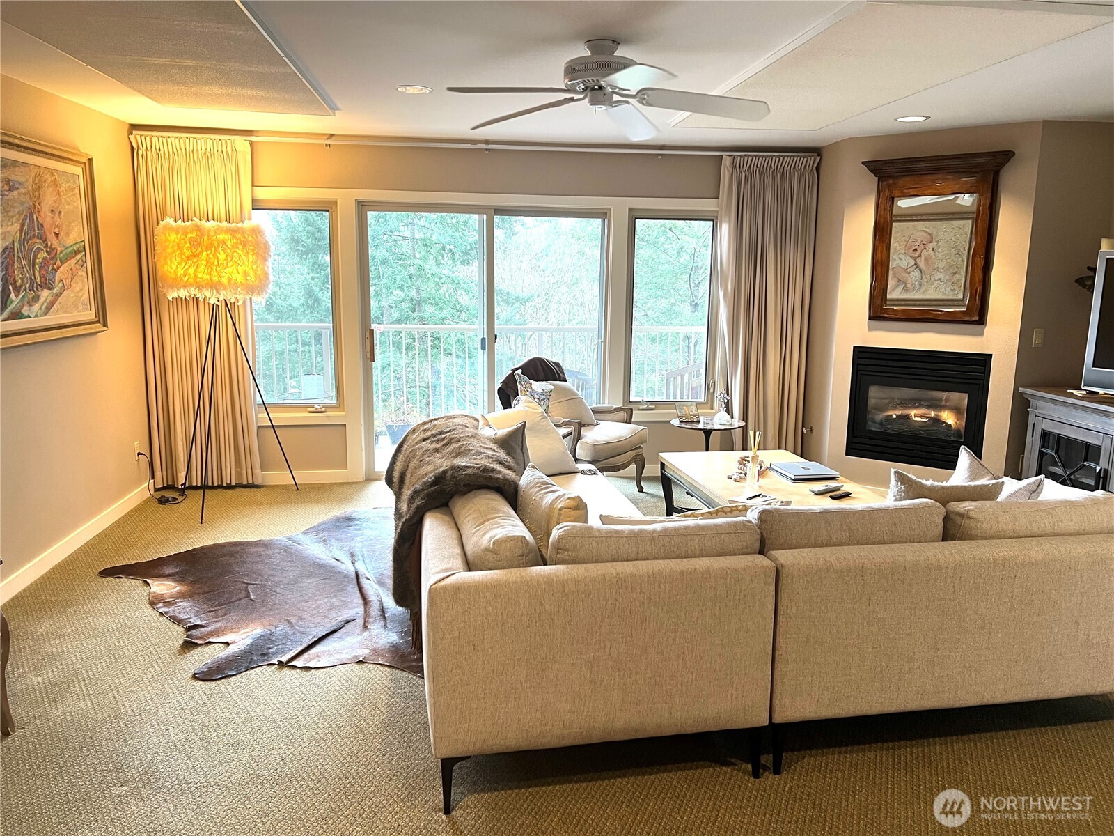 1917 Rosario Road, Unit 2115 Orcas Island, WA 98245 - Photo 2 of 14 a living room with furniture and a floor to ceiling window
