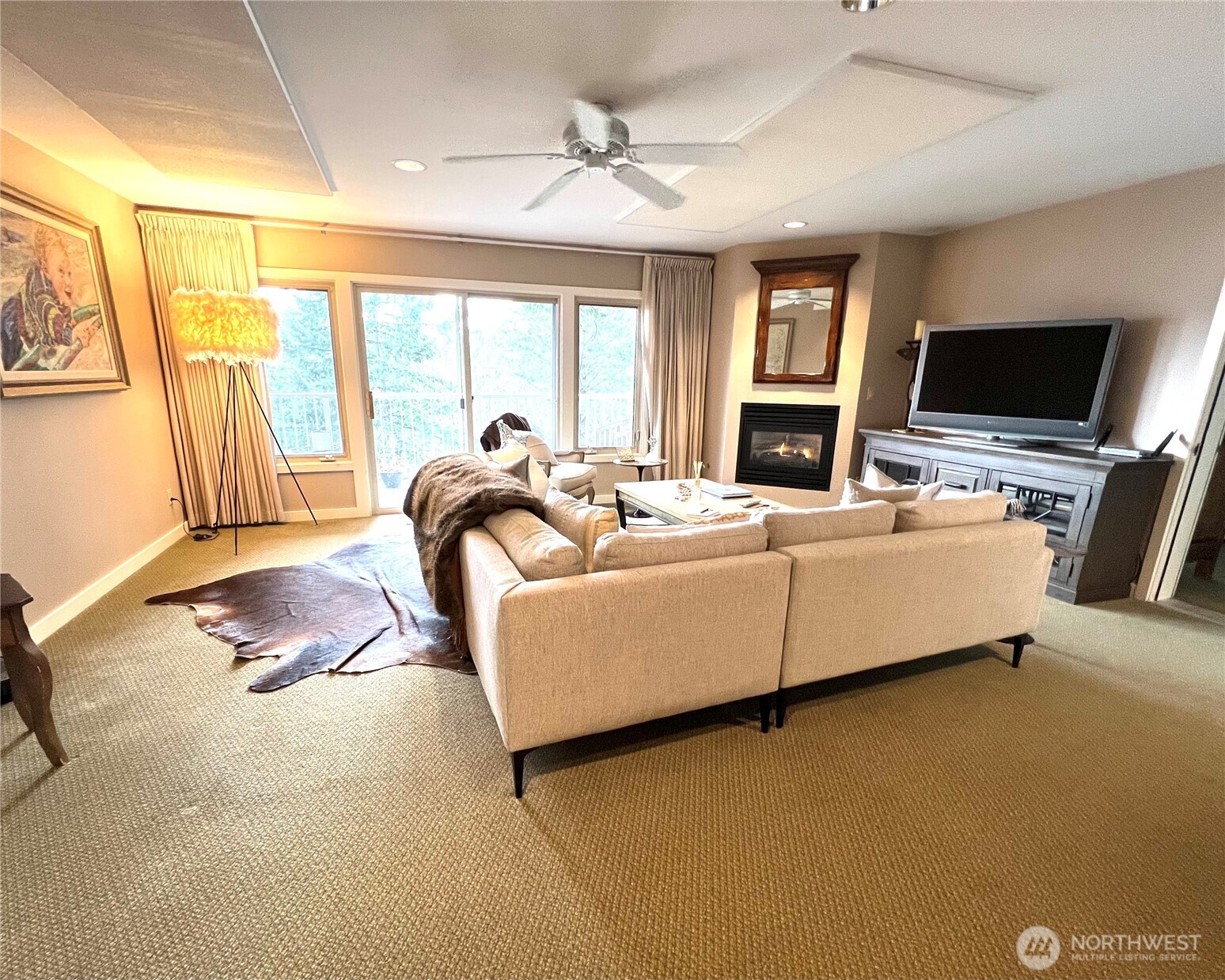1917 Rosario Road, Unit 2115 Orcas Island, WA 98245 - Photo 4 of 14 a living room with furniture and a flat screen tv