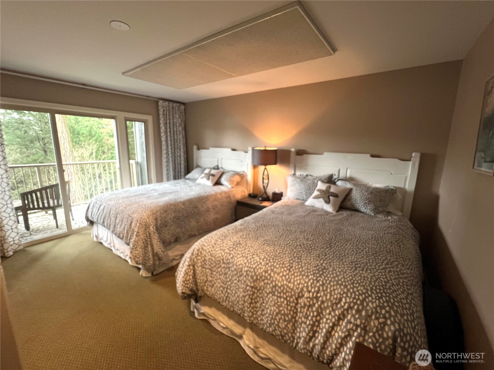 1917 Rosario Road, Unit 2115 Orcas Island, WA 98245 - Photo 7 of 14 a bedroom with two beds and a large window