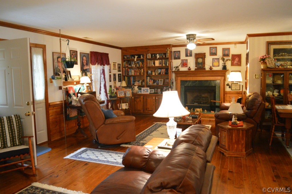 1820 Mill Road Henrico, VA 23231 - Photo 3 of 24 a living room with furniture a lamp and a fireplace