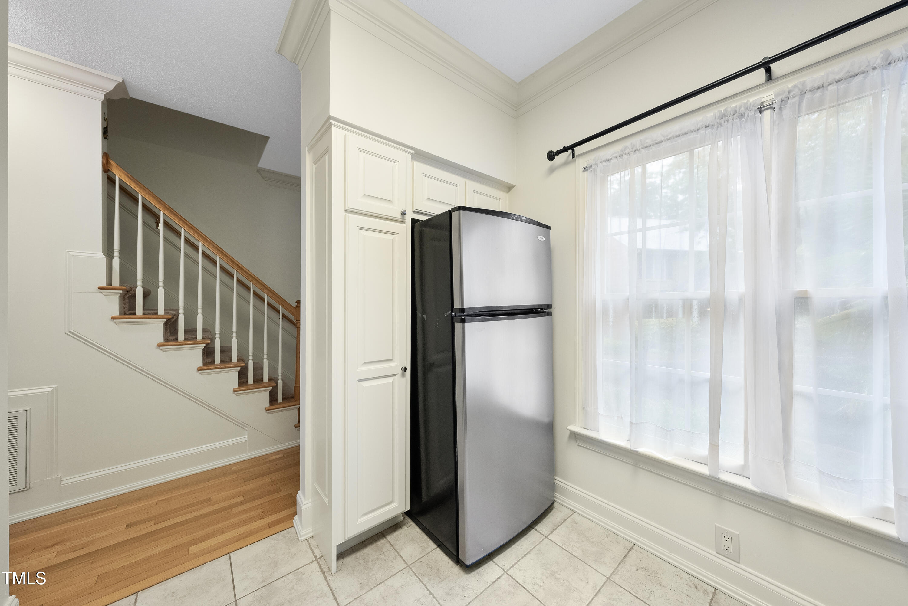1403 Governors Court Raleigh, NC 27604 - Photo 11 of 34 a view of entryway with wooden floor and door