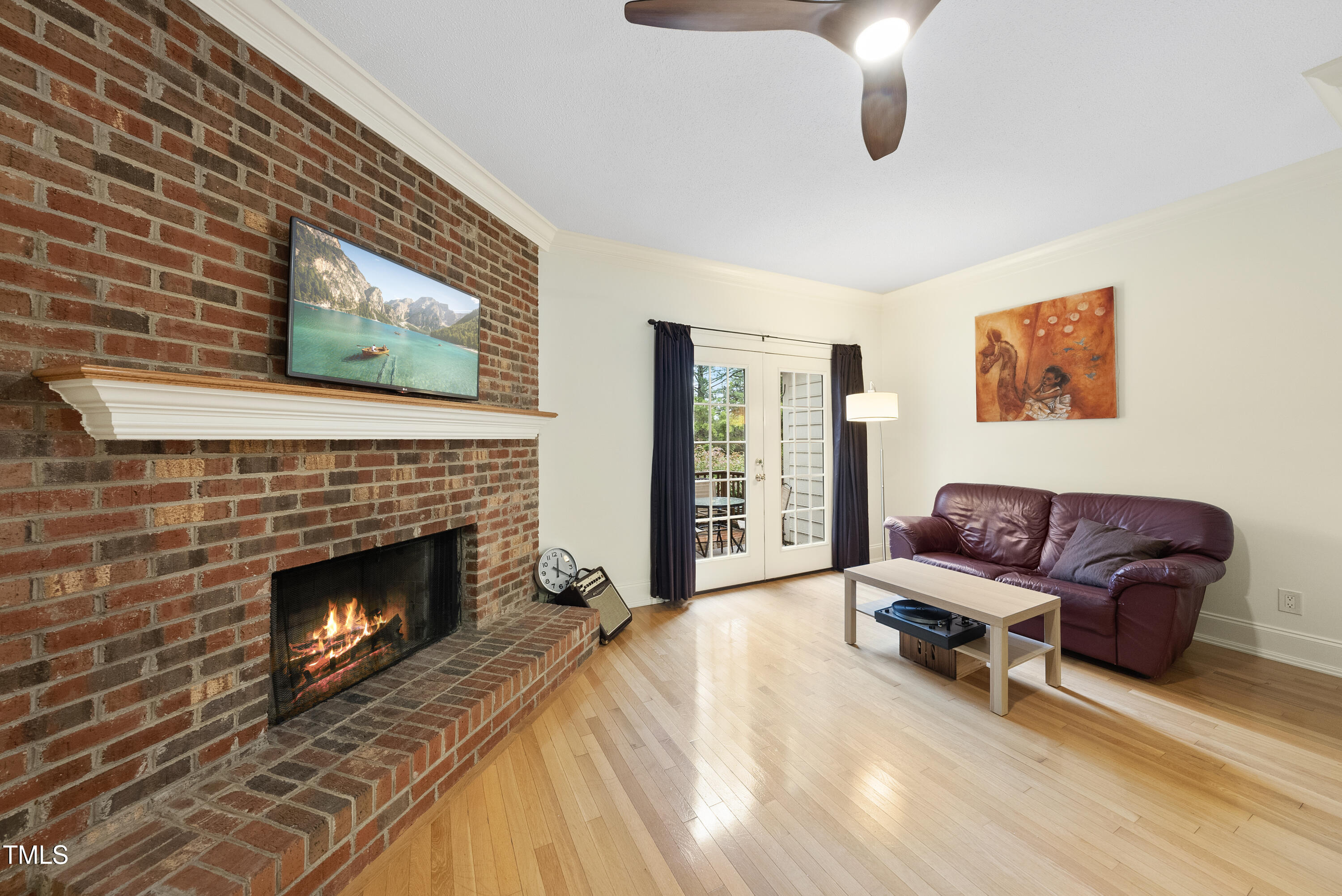 1403 Governors Court Raleigh, NC 27604 - Photo 12 of 34 a living room with furniture and a fireplace