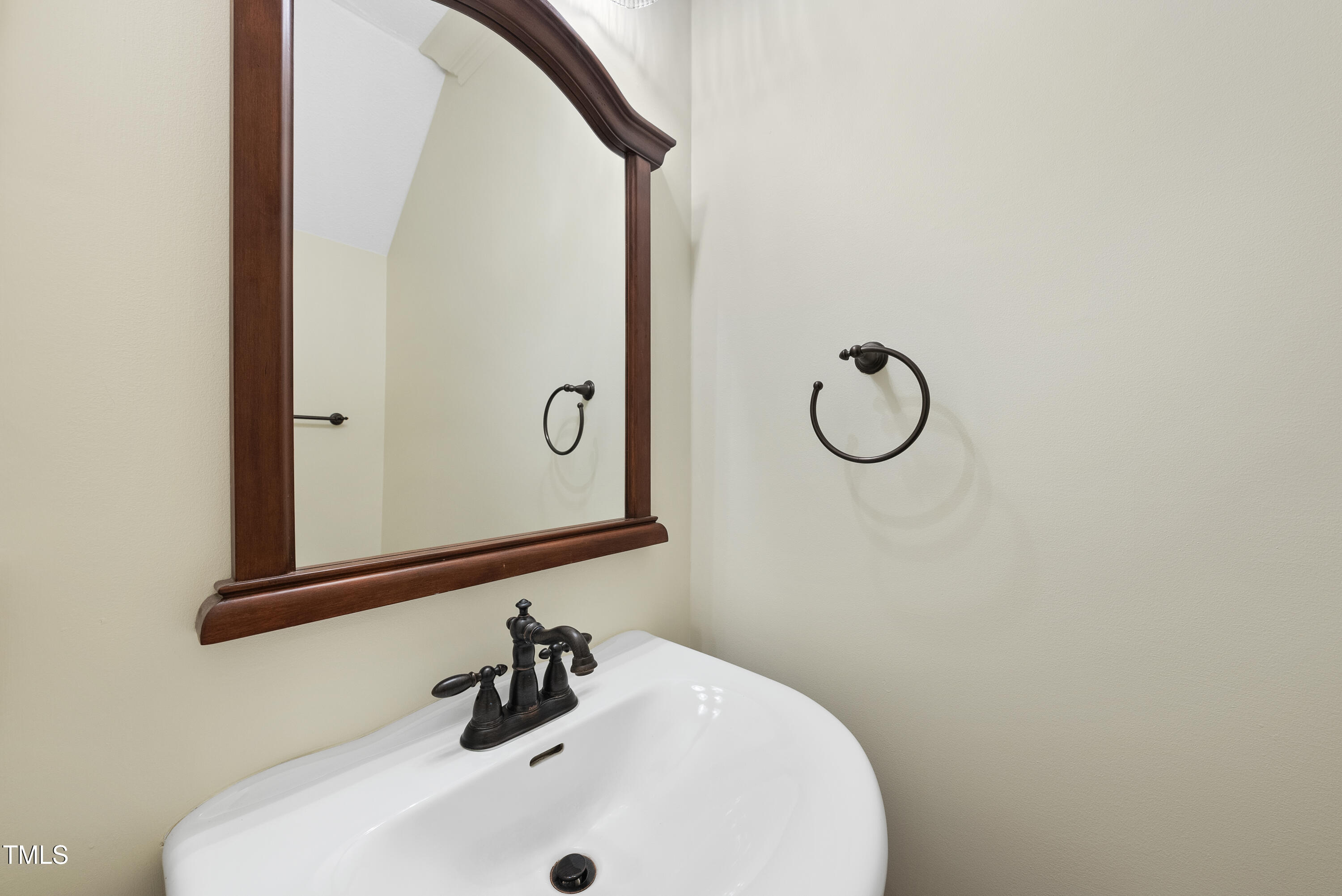 1403 Governors Court Raleigh, NC 27604 - Photo 14 of 34 a bathroom with a sink and a mirror