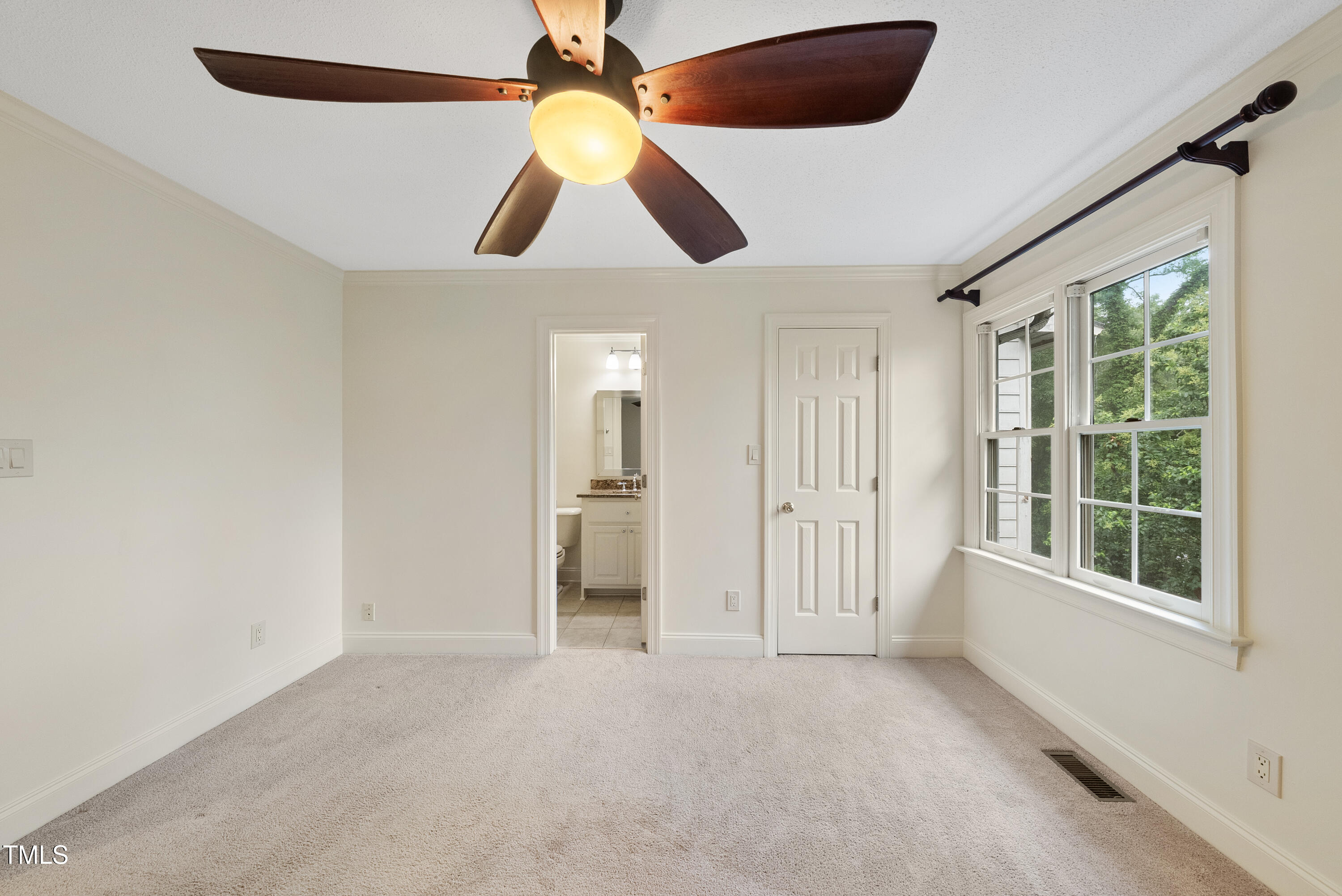 1403 Governors Court Raleigh, NC 27604 - Photo 19 of 34 an empty room with windows and fan