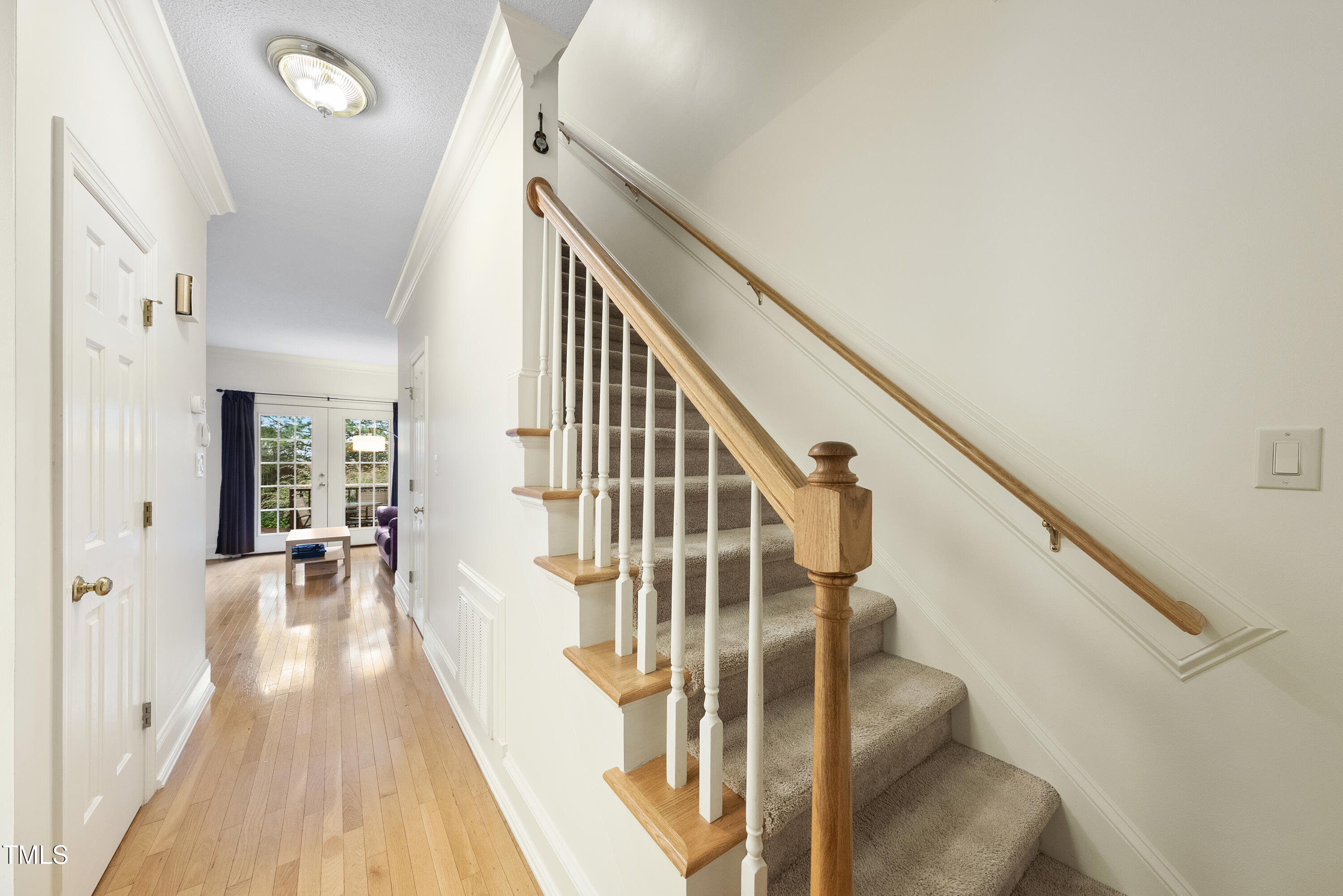 1403 Governors Court Raleigh, NC 27604 - Photo 2 of 34 a view of entryway and hall with wooden floor
