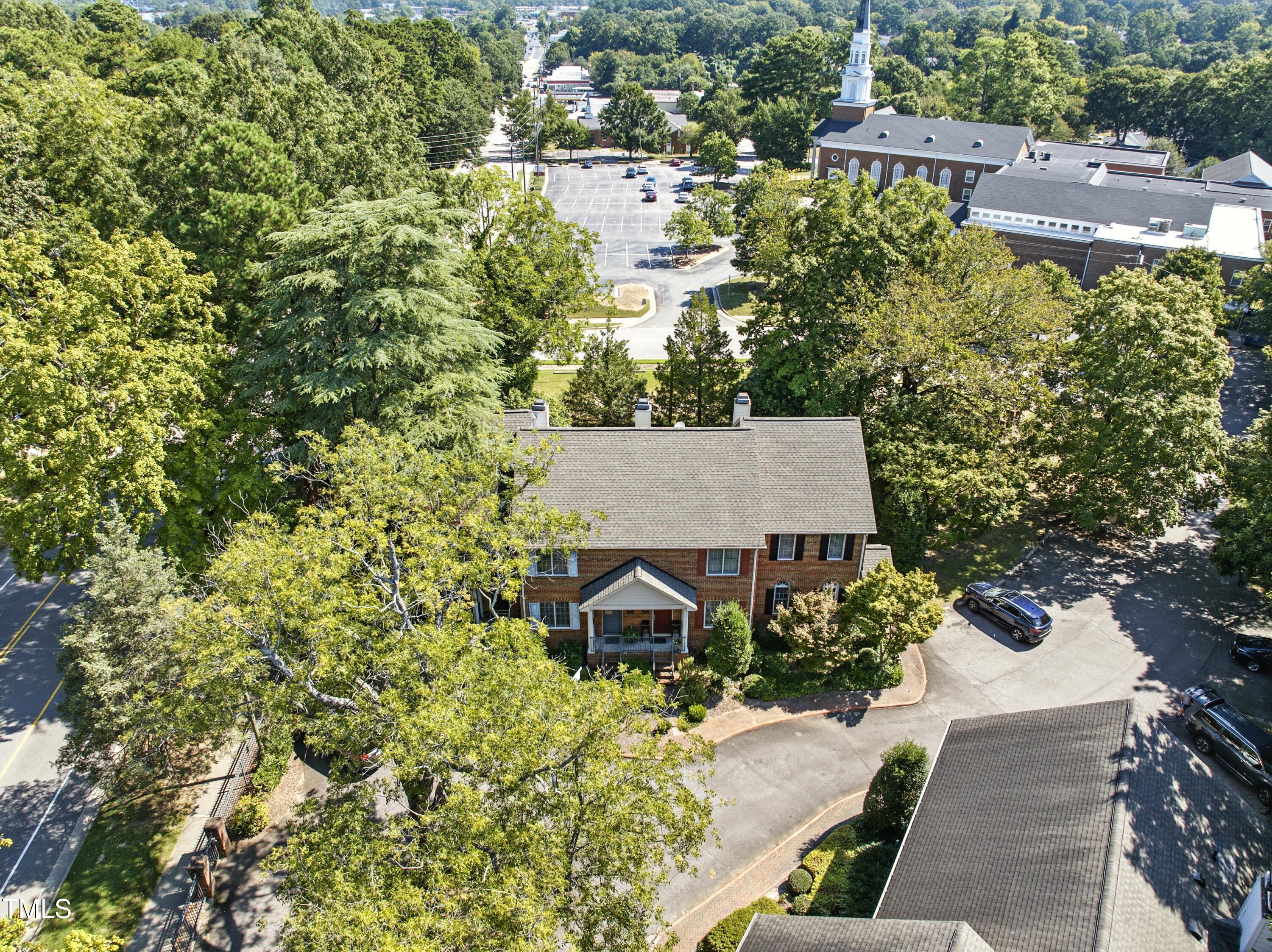 1403 Governors Court Raleigh, NC 27604 - Photo 22 of 34 an aerial view of a house with yard and trees all around