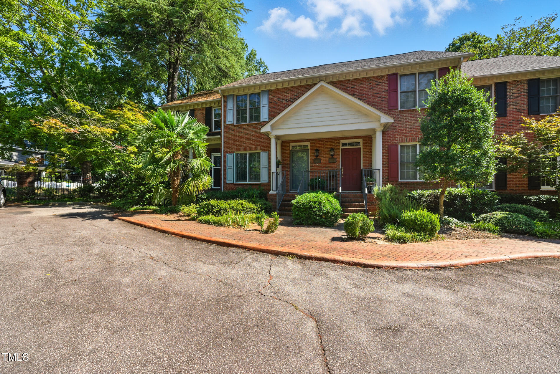 1403 Governors Court Raleigh, NC 27604 - Photo 33 of 34 a front view of a house with a yard and garage