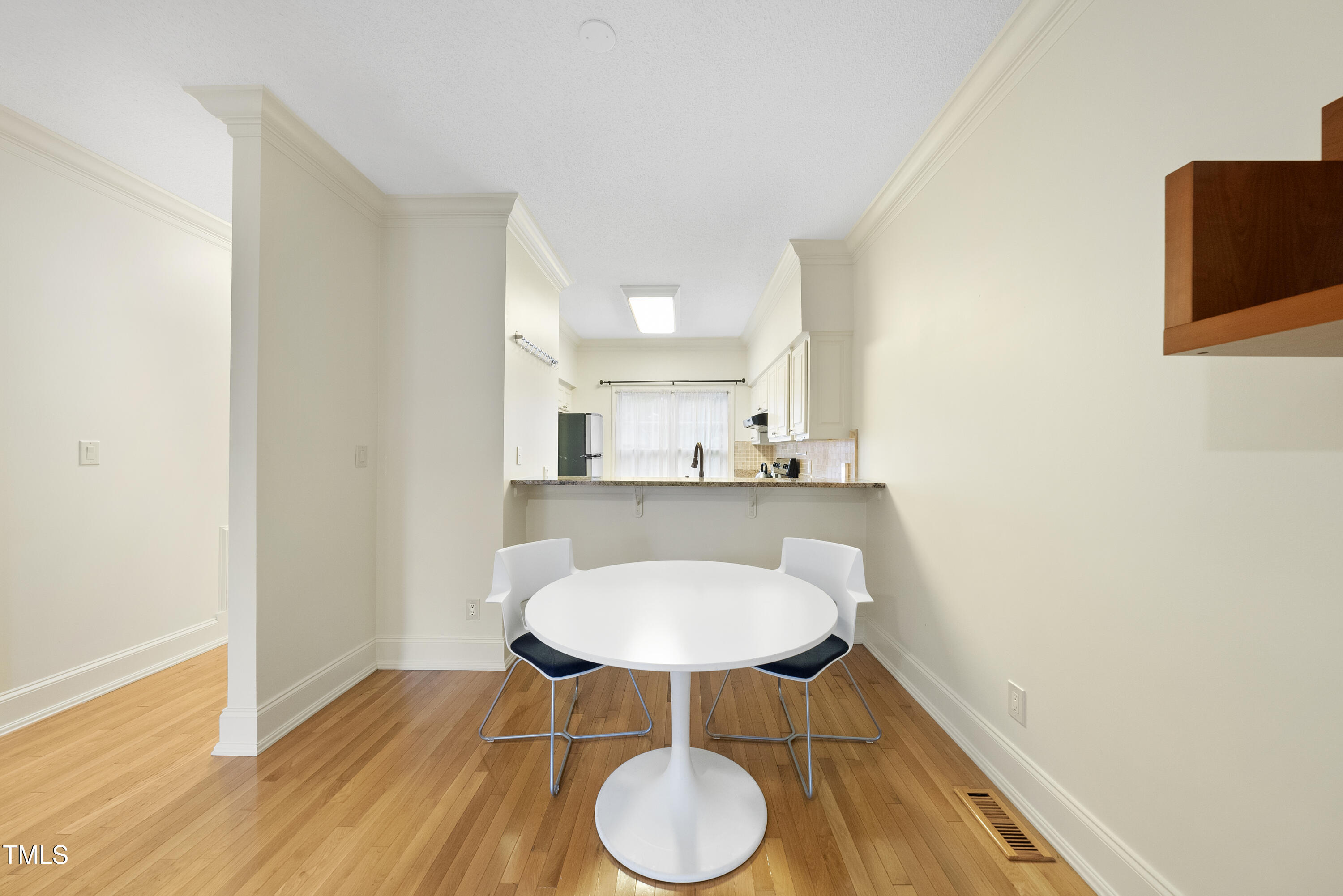 1403 Governors Court Raleigh, NC 27604 - Photo 7 of 34 a bathroom with a sink a mirror and a toilet
