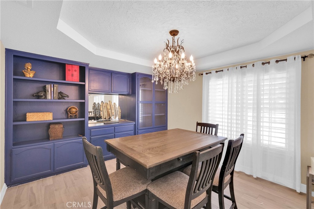 15908 Acoma Road Apple Valley, CA 92307 - Photo 17 of 62 Dinning Area with built in hutch and gorgeous chandelier