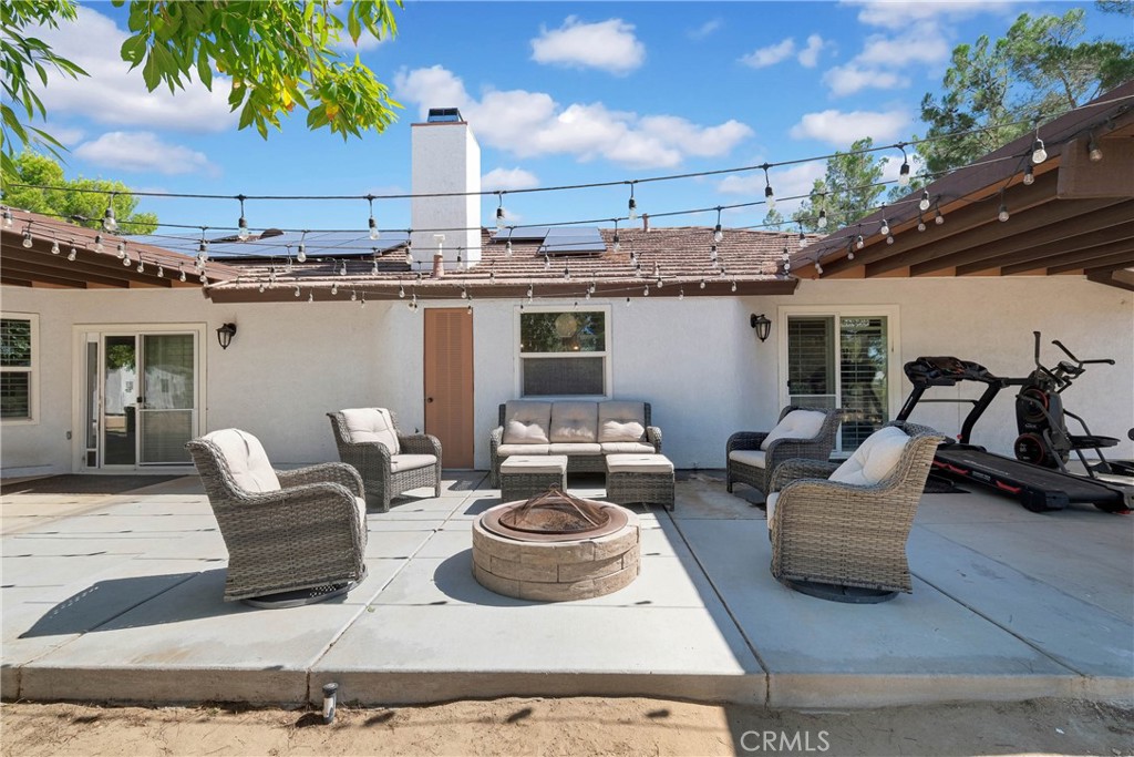 15908 Acoma Road Apple Valley, CA 92307 - Photo 45 of 62 Backyard middle
patio area open to view night stars in between covered areas.