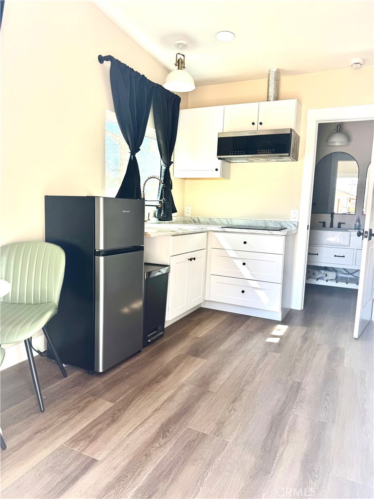 15908 Acoma Road Apple Valley, CA 92307 - Photo 60 of 62 Studio bonus space left side kitchenette area w/ window view over sink area.