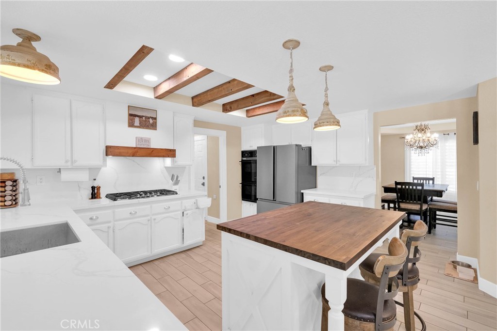 15908 Acoma Road Apple Valley, CA 92307 - Photo 10 of 62 Kitchen features a beautiful butcher block island