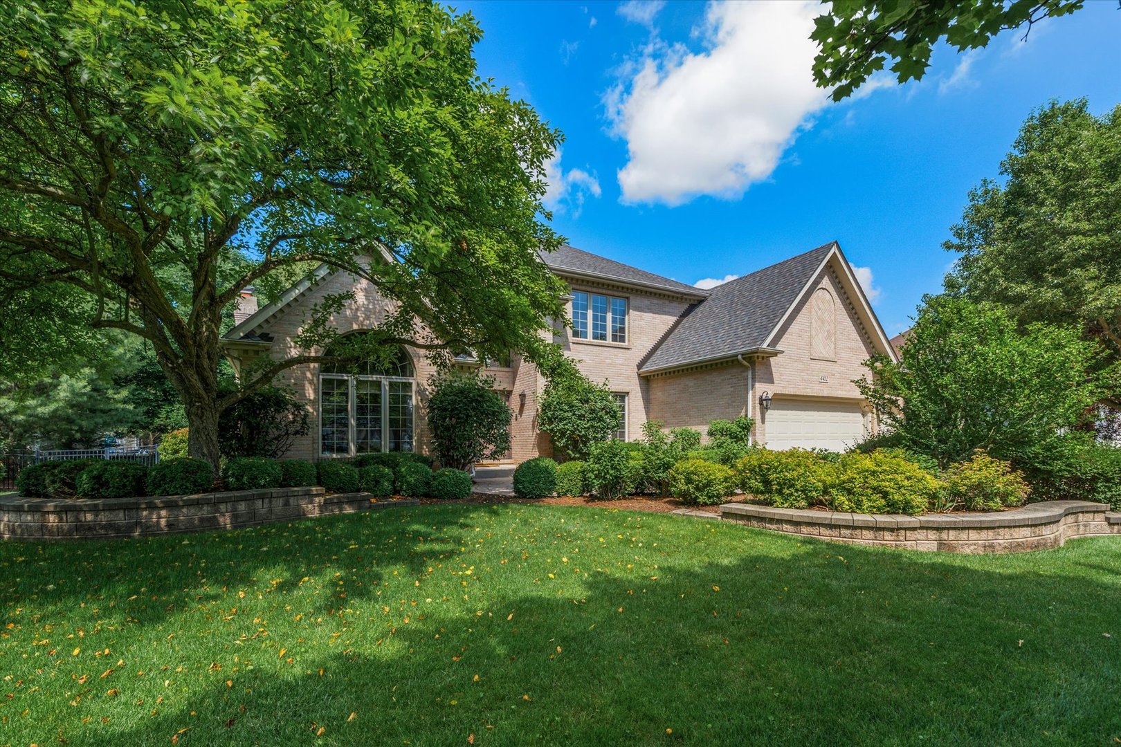 4412 Esquire Circle Naperville, IL 60564 - Photo 1 of 1 a view of a house with a big yard potted plants and large tree