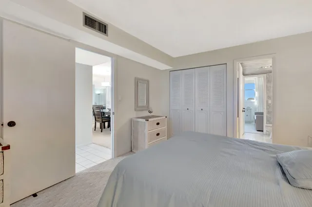 a spacious bedroom with a bathtub and a shower