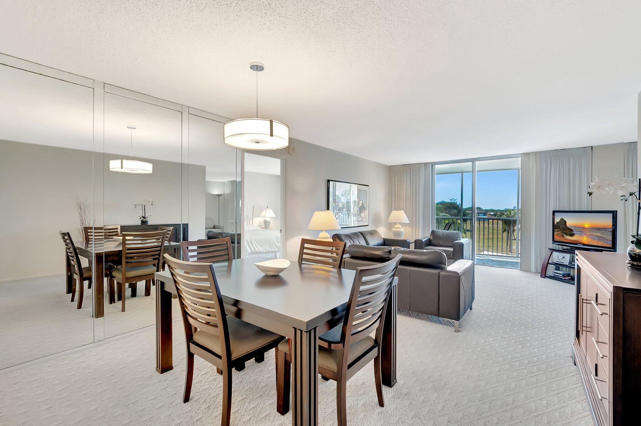 6699 Northwest 2nd Avenue, Unit 410 Boca Raton, FL 33487 - Photo 5 of 29 a view of a dining room with furniture