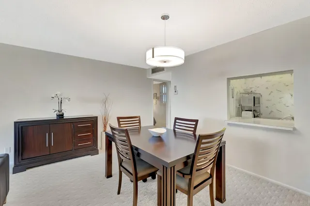 a view of a dining room furniture and chandelier
