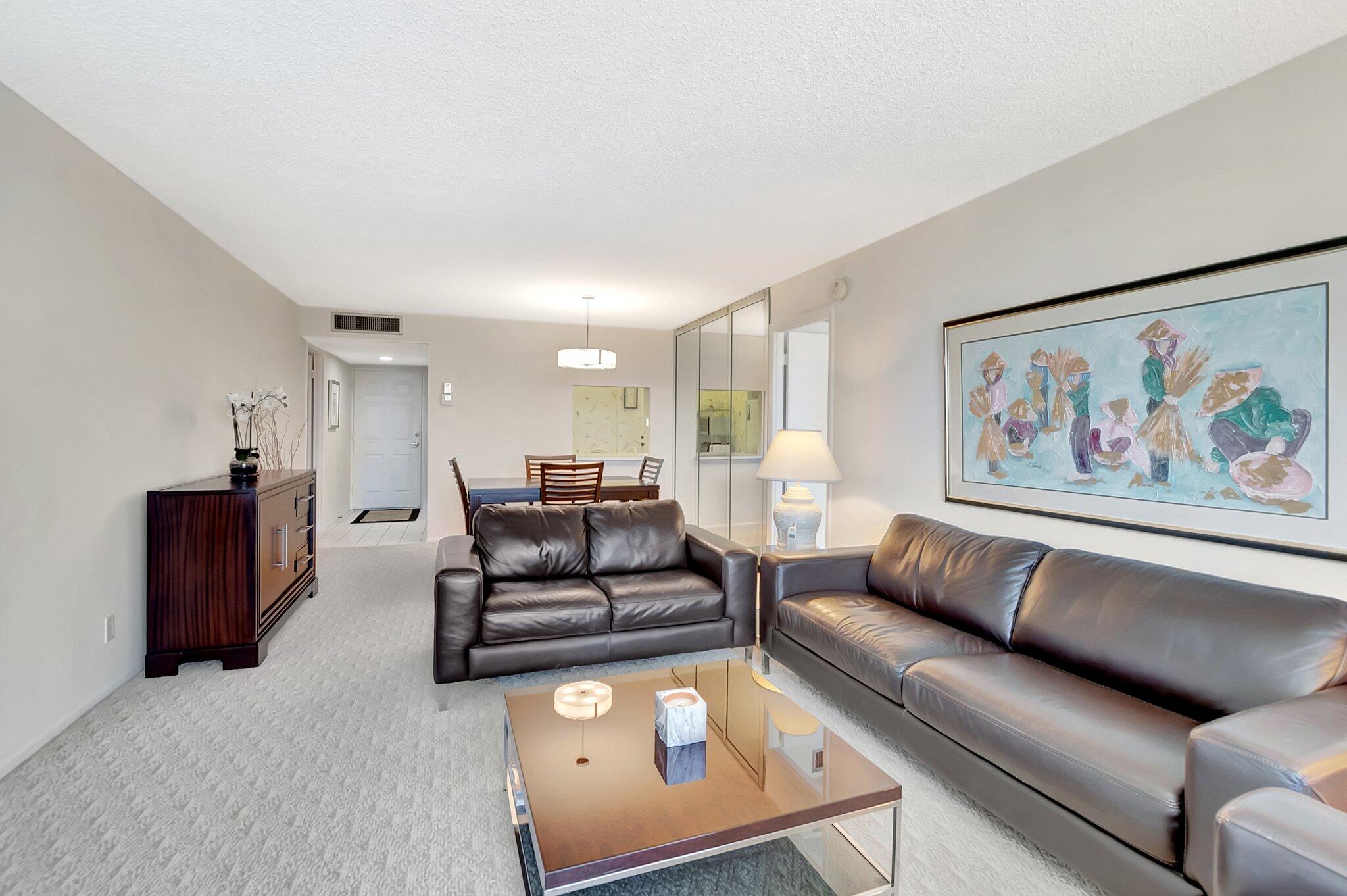 6699 Northwest 2nd Avenue, Unit 410 Boca Raton, FL 33487 - Photo 8 of 29 a living room with furniture and a couch