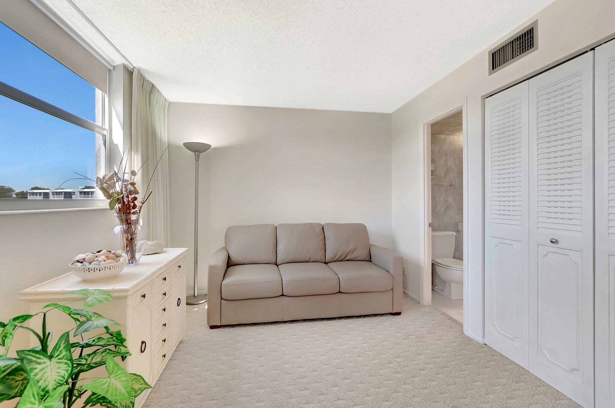 6699 Northwest 2nd Avenue, Unit 410 Boca Raton, FL 33487 - Photo 9 of 29 a living room with furniture